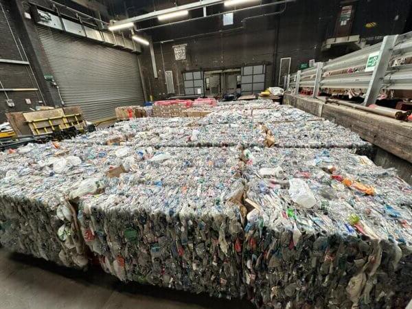 Bundles of plastic waste in a depot at Euston rail station